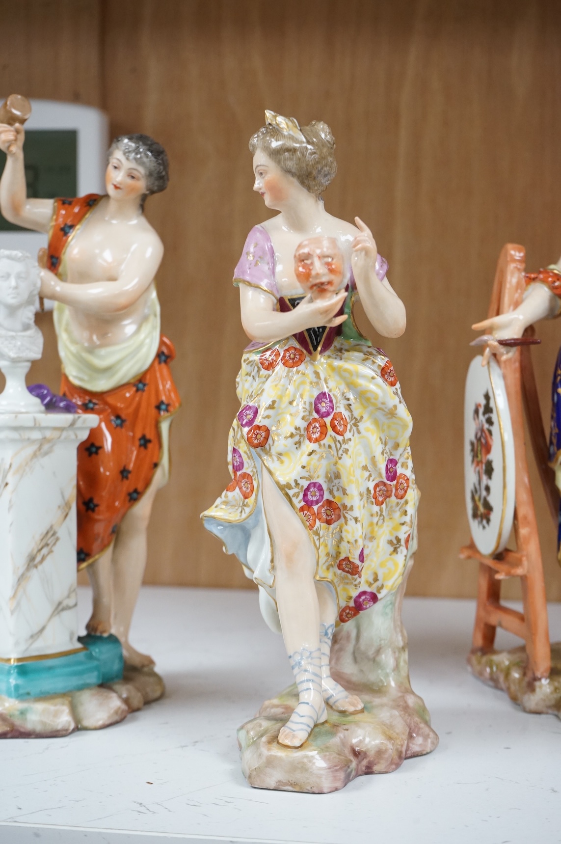 A set of four French Derby style porcelain figures, emblematic of art, sculpture, music and theatre, tallest art 22.5cm high